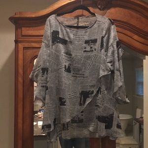 Newspaper print blouse. Washable and very to pack.